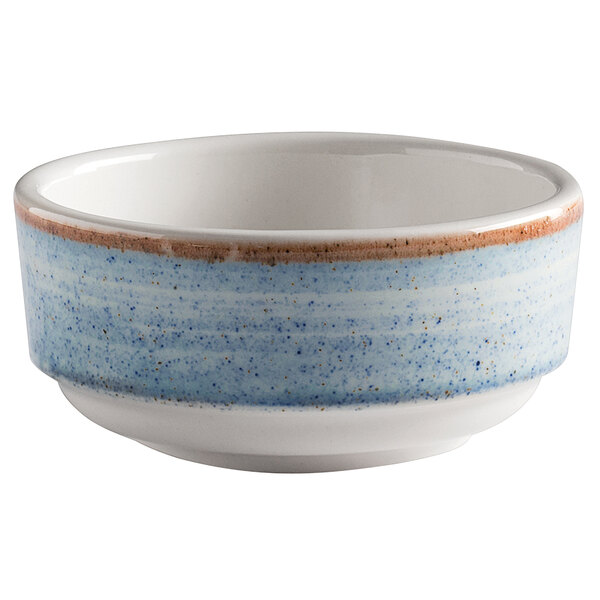 A white porcelain bowl with a blue speckled rim.