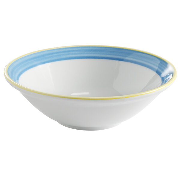 A white Corona by GET Enterprises porcelain bowl with a blue and yellow striped rim.