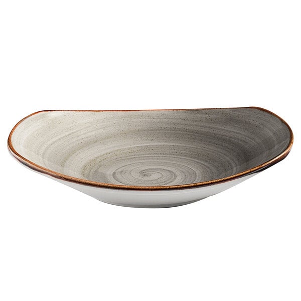 A grey porcelain pasta bowl with a spiral pattern on the rim.