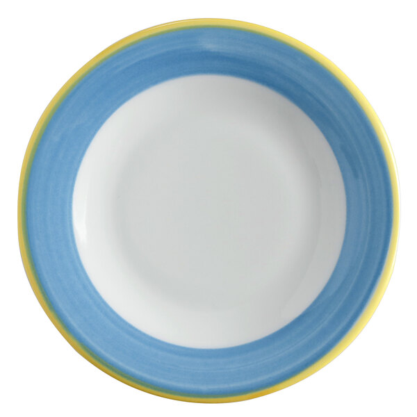 A close-up of a white porcelain plate with a blue and yellow rim.