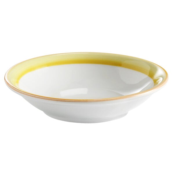A white porcelain bowl with a yellow rim.