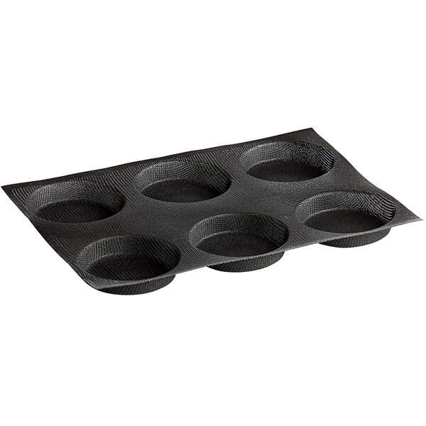 A black silicone bread mold with six compartments.