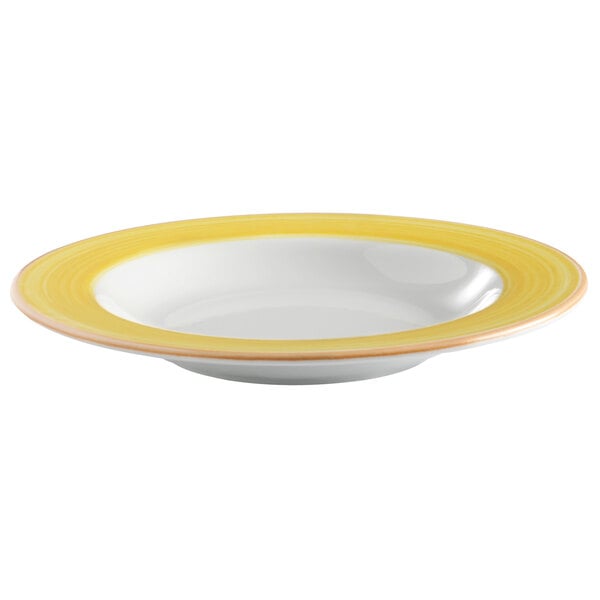 A bright white porcelain bowl with a yellow and coral rim.