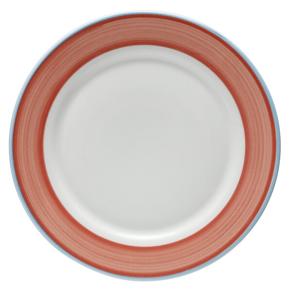 A white porcelain plate with a red and coral rim.