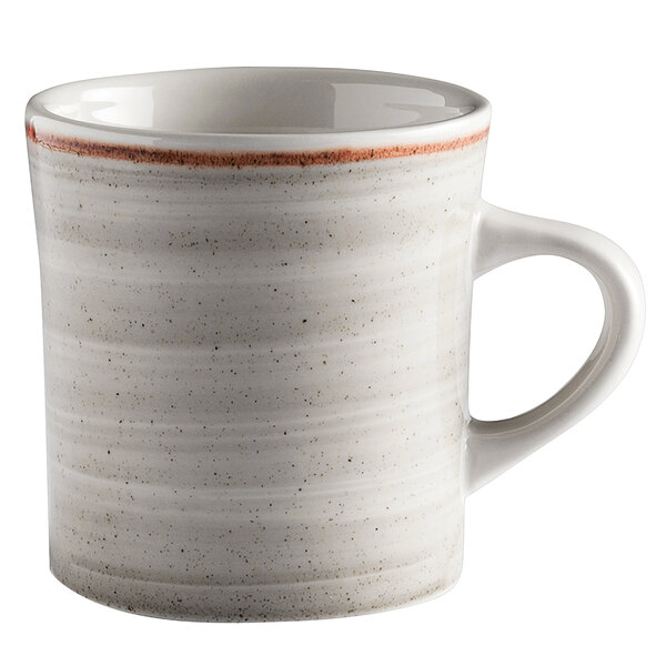 A white mug with a red rim.