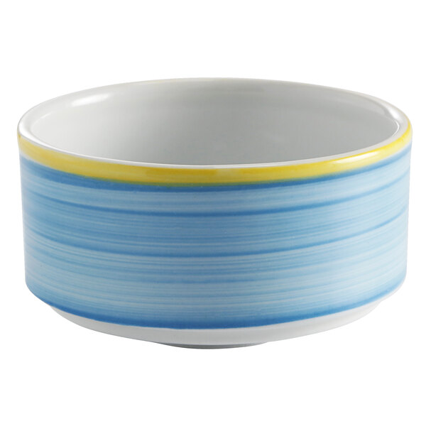 A close up of a blue bowl with a yellow stripe.