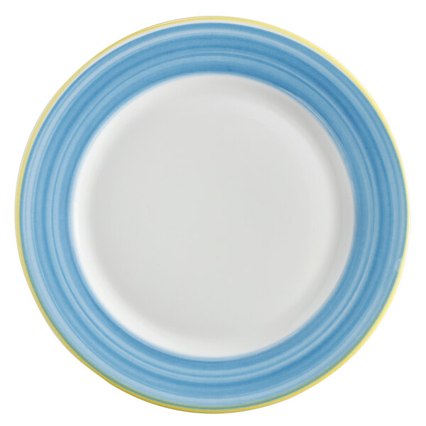 A white porcelain plate with a blue and yellow rim.
