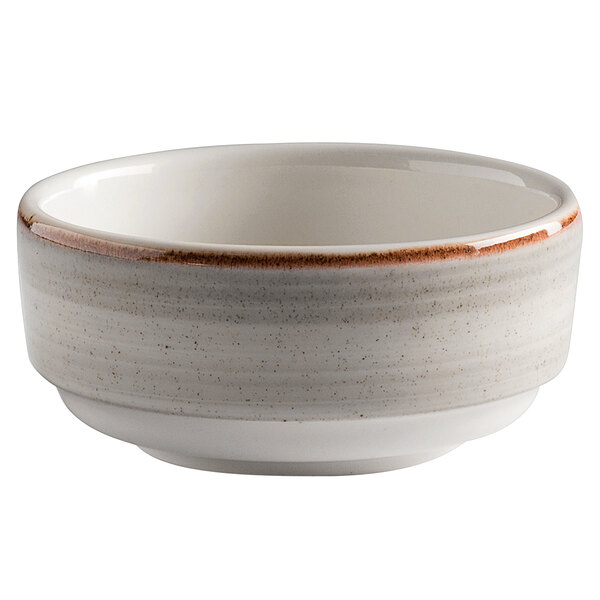 A white porcelain bowl with a brown speckled rim.