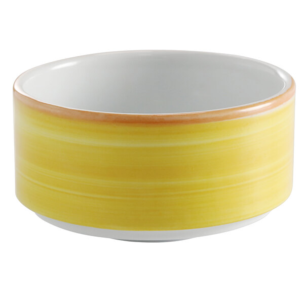 A yellow and white porcelain stackable soup cup.