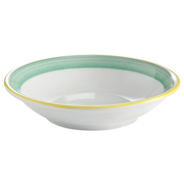 A white porcelain monkey dish with green and yellow rims.
