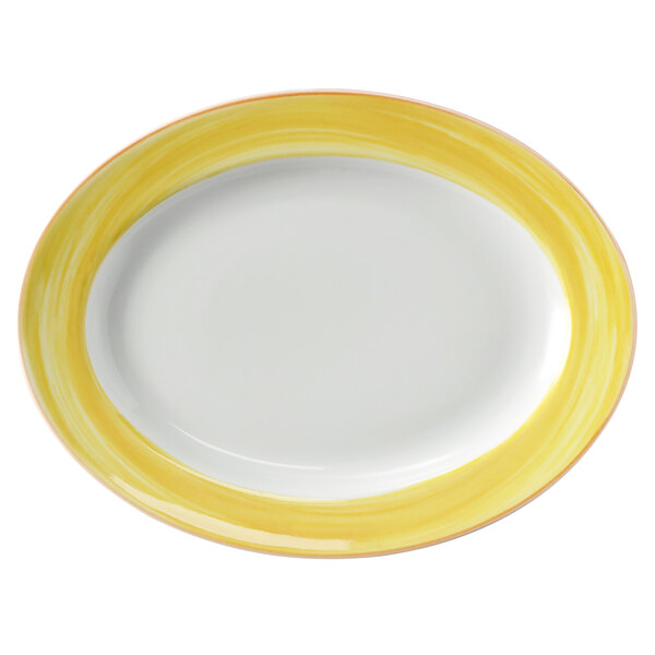 A white porcelain oval platter with a yellow and coral rim.