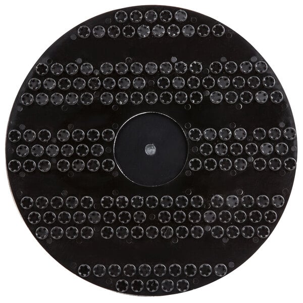 A black Oreck 12" pad driver, a circular black disc with many small holes.