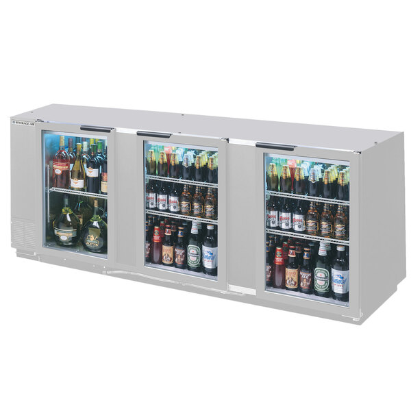 A Beverage-Air stainless steel back bar wine refrigerator with drinks in it.