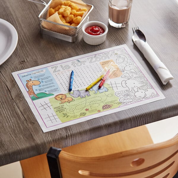 A table with a Choice kids zoo themed interactive placemat with a drawing on it and food.