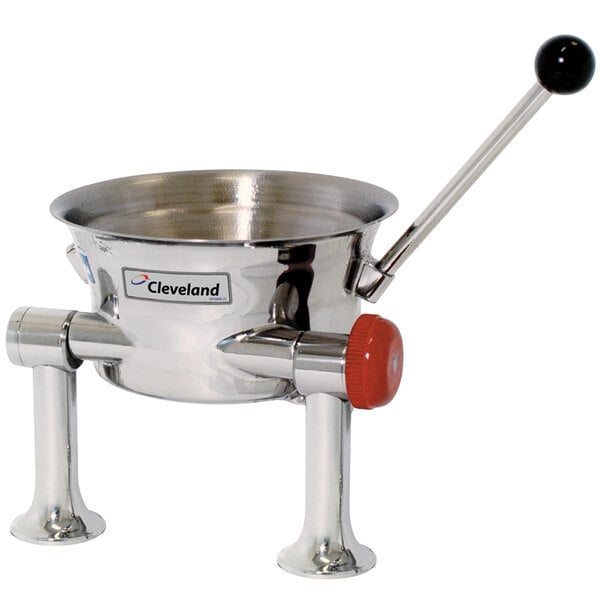 A Cleveland stainless steel tilting steam kettle with a red handle.