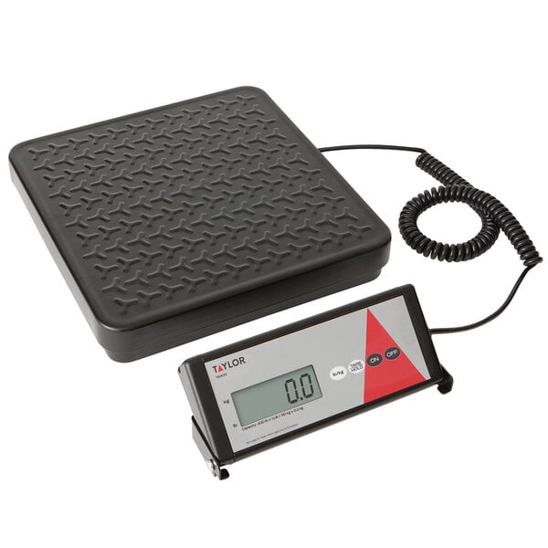 A black Taylor digital receiving scale with a remote display.