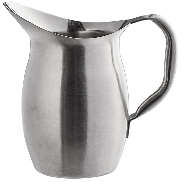 A silver stainless steel Libbey Belle pitcher with a handle.