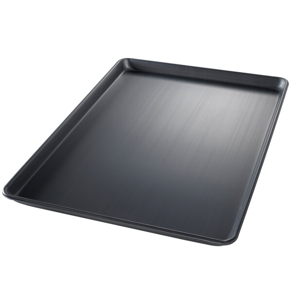 A Chicago Metallic BAKALON wire in rim aluminum sheet pan with a black tray and a metal handle.