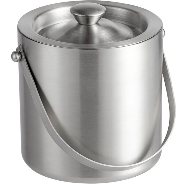 A silver metal Libbey ice bucket with a handle.