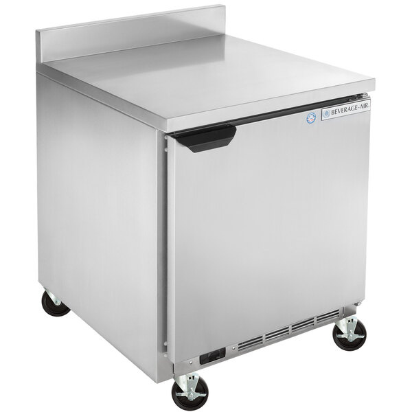 A silver Beverage-Air worktop refrigerator with wheels.