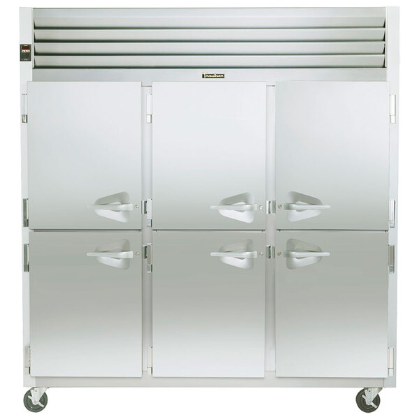 A close-up of a stainless steel Traulsen reach-in freezer with four doors.