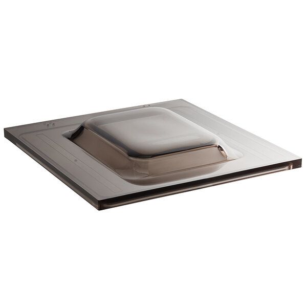 A square metal tray with a lid on top.