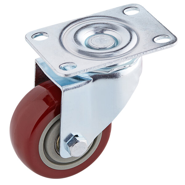 A VacPak-It metal plate caster with a red wheel and base.