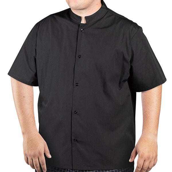 A man wearing a black Uncommon Chef cook shirt with a mandarin collar.