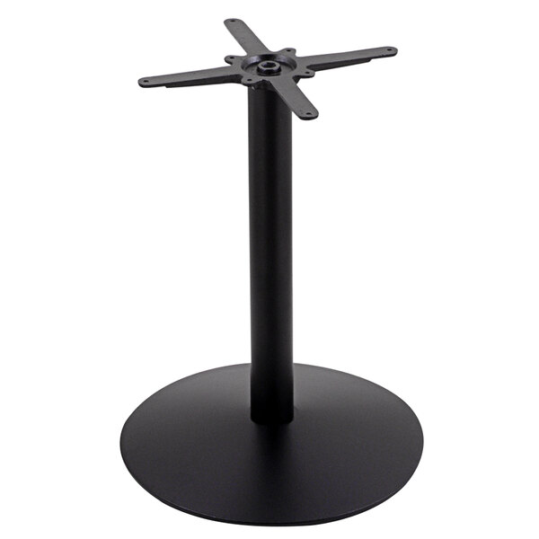 A black metal pole with a round base.