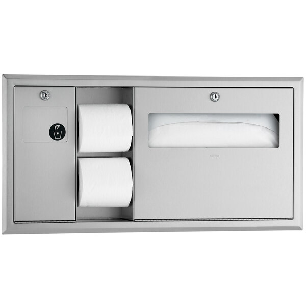 A Bobrick recessed toilet paper dispenser with a door holding two rolls of toilet paper.