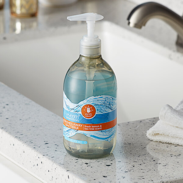 A bottle of Seventh Generation Lemon & Tea Tree liquid hand soap with a pump on a counter.