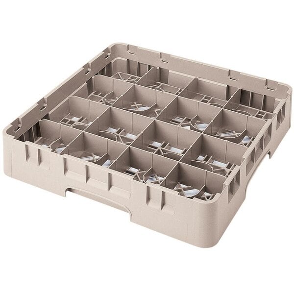 A beige plastic Cambro glass rack with 16 compartments and a grid.