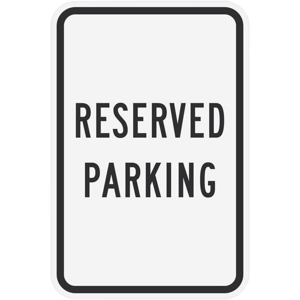 A white rectangular Lavex "Reserved Parking" sign with black text.