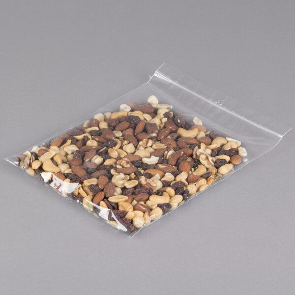 A LK Packaging plastic food bag of nuts on a gray surface.