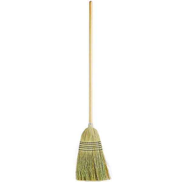 A Carlisle 5-stitch janitor broom with a wooden handle.