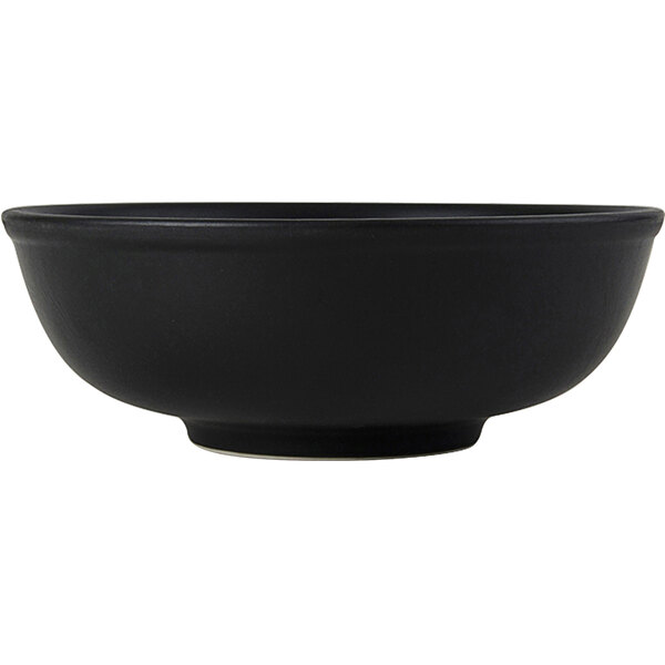 A black Tuxton China menudo bowl.