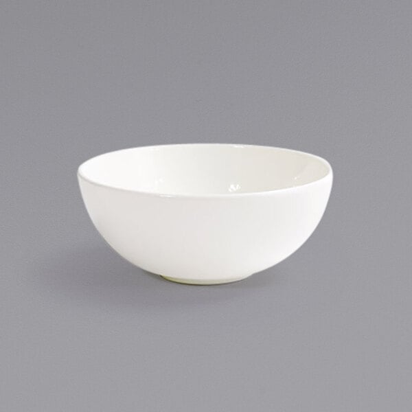 A close up of a Front of the House European White porcelain ramekin.