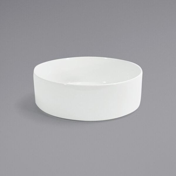 A Front of the House Soho white porcelain bowl on a gray surface.