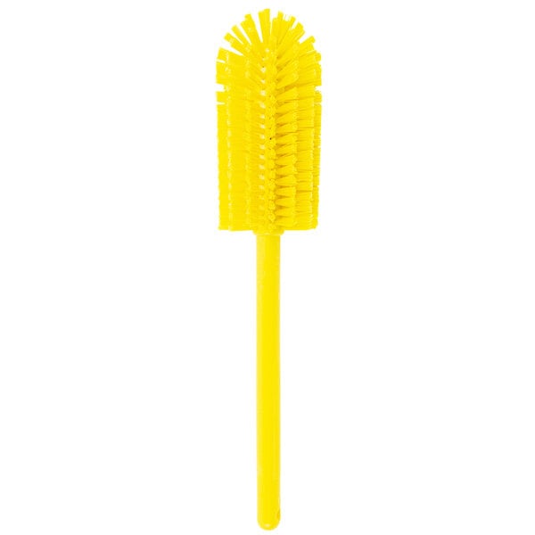 A yellow Carlisle bottle cleaning brush with a handle.
