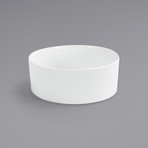 A Front of the House Soho bright white porcelain bowl on a gray surface.