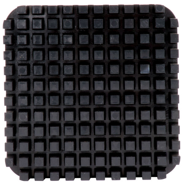A black square Nemco push block with squares on it.