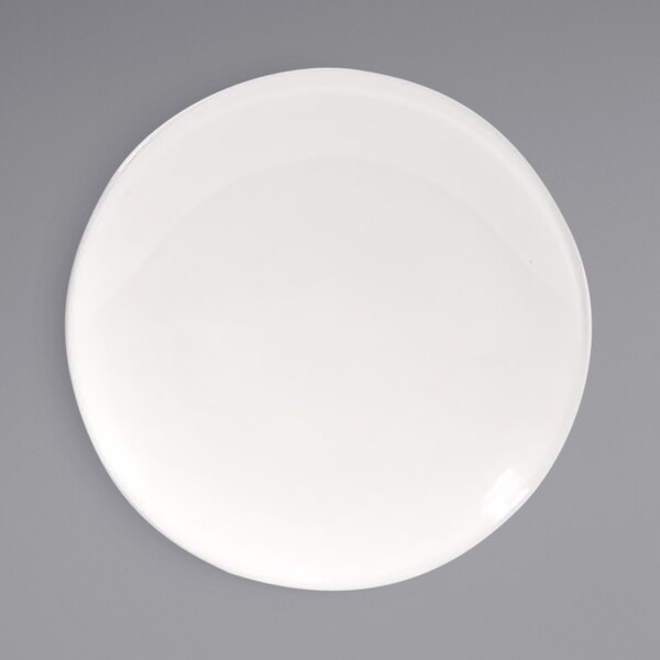 A Front of the House European white porcelain plate with a white rim.