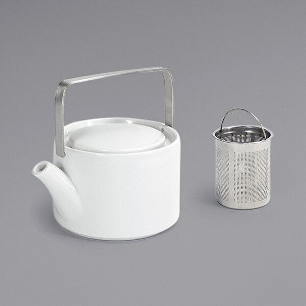 A white teapot with a handle and strainer inside.