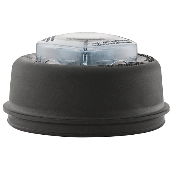 A black round lid with a clear plastic center on a Vitamix container.