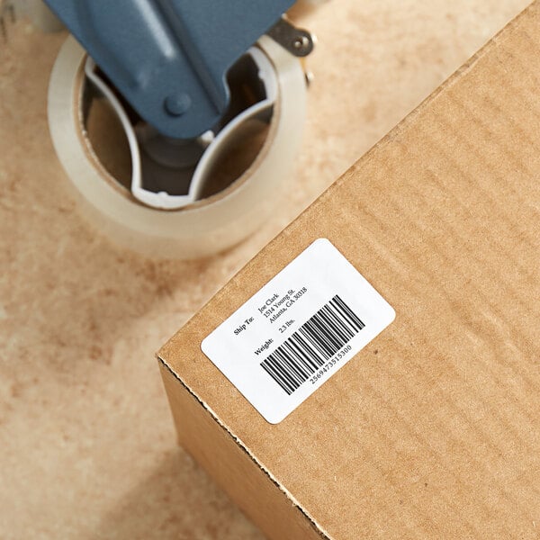 A close-up of a box with a Lavex blank white mailing label on it.