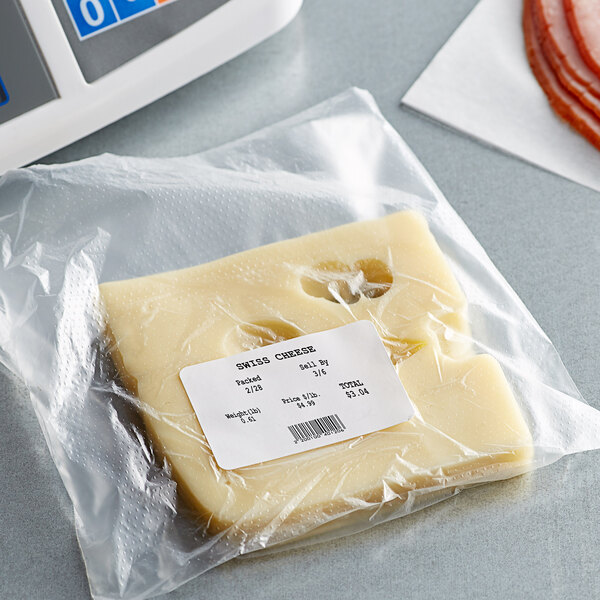 A package of white blank labels for a Point Plus scale on a deli counter.