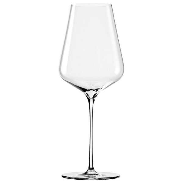 A close-up of a clear Stolzle Bordeaux wine glass with a long stem.