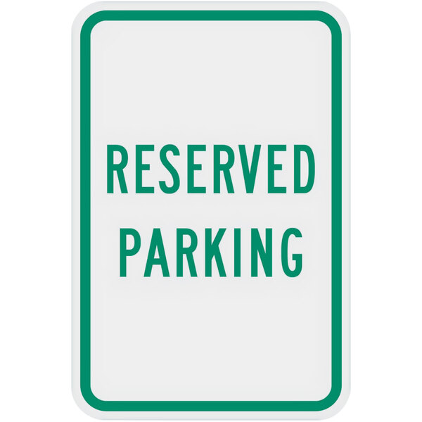 A white and green sign that says "Reserved Parking" in green text.