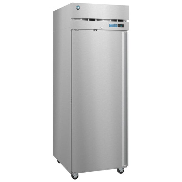 A stainless steel Hoshizaki reach-in freezer with a door open.