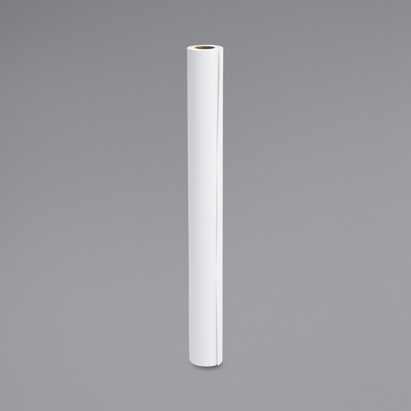 A white roll of Epson presentation paper on a gray surface.